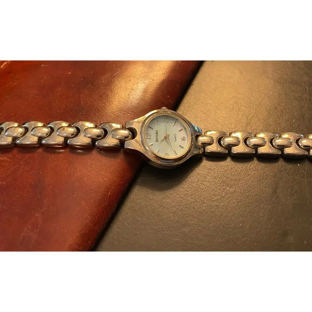 Women's Silver Tone Scketches Watch. Light Blue Face